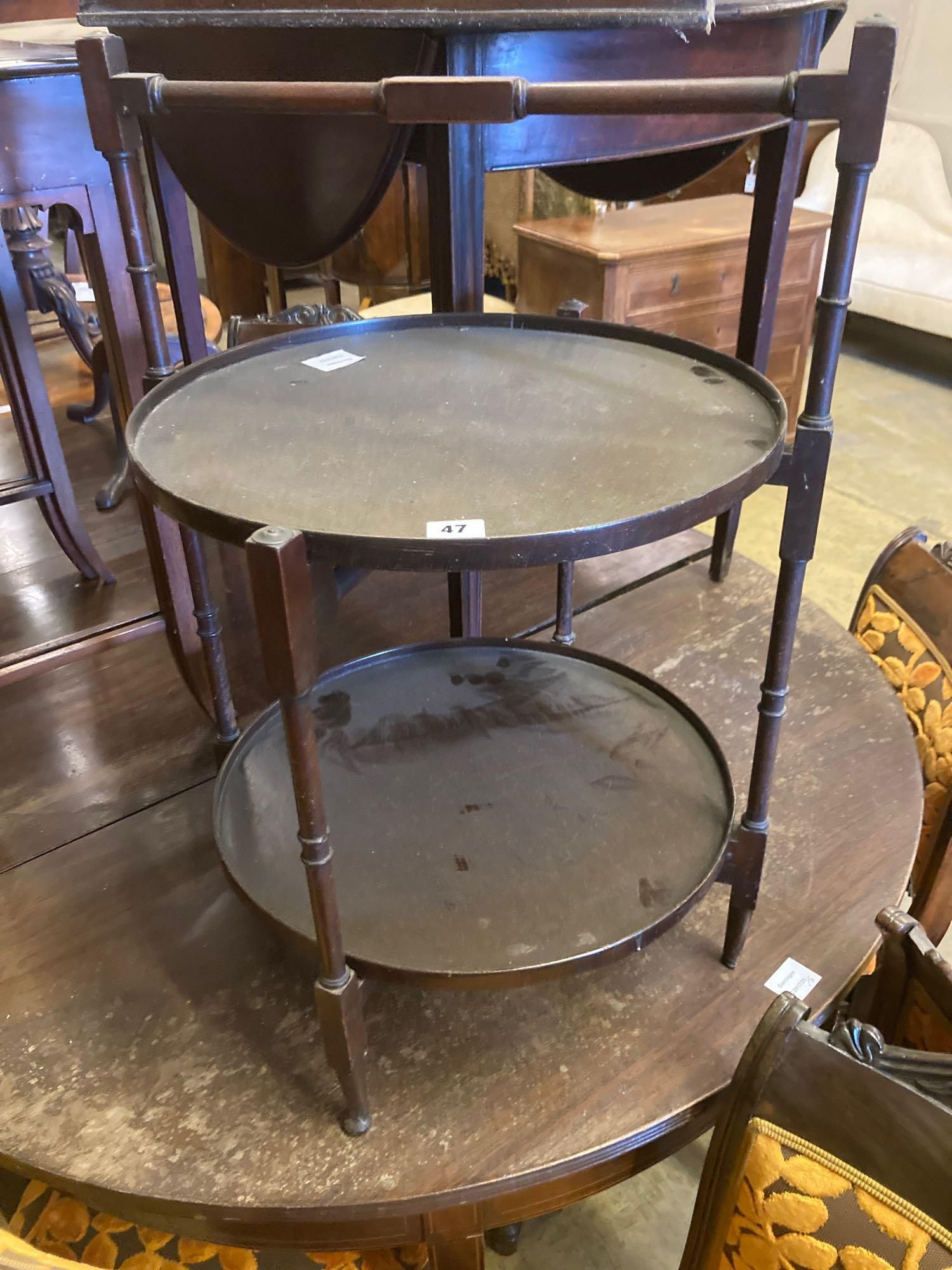 An Edwardian mahogany two tier folding occasional table, width 48cm height 71cm